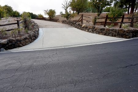 Custom Stone Wall Lined Driveway