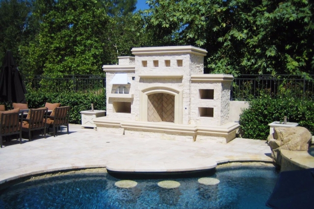 Poolside Concrete Fireplace with Pizza Oven