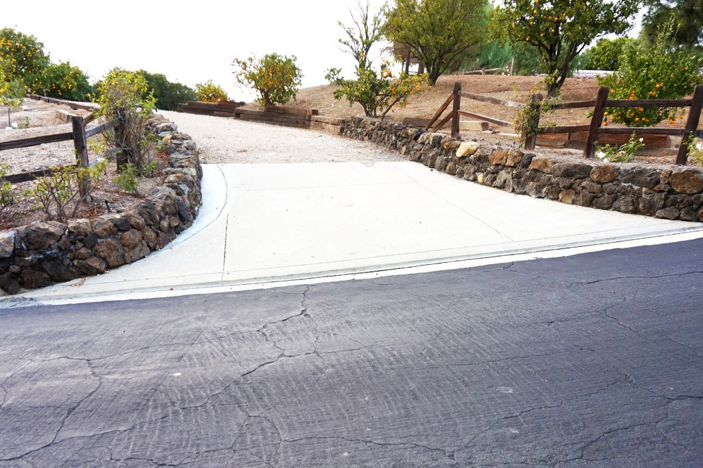 Concrete Driveway with Stone Retaining Walls Concrete Driveway with Stone Retaining Walls