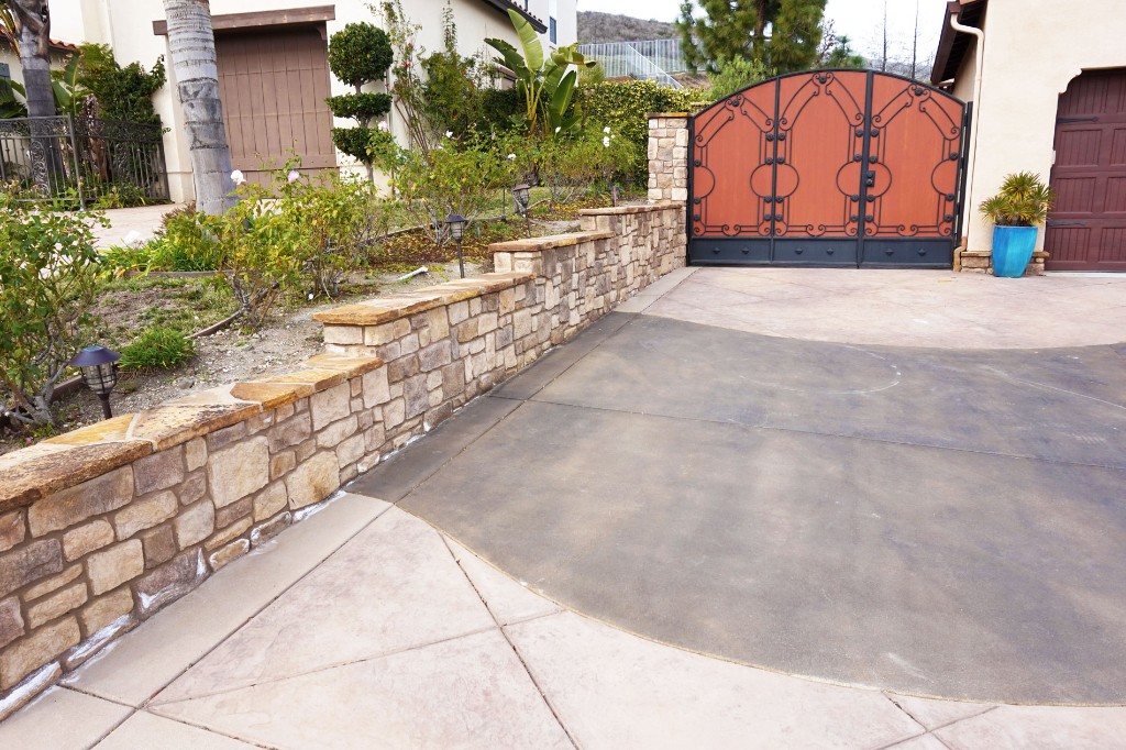 Stamped Concrete Driveway with Stone Retaining Wall Stamped Concrete Driveway with Stone Retaining Wall